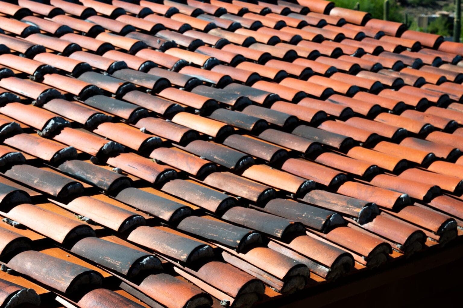 Close-up of clay barrel roof tiles on an Arizona home in full sun