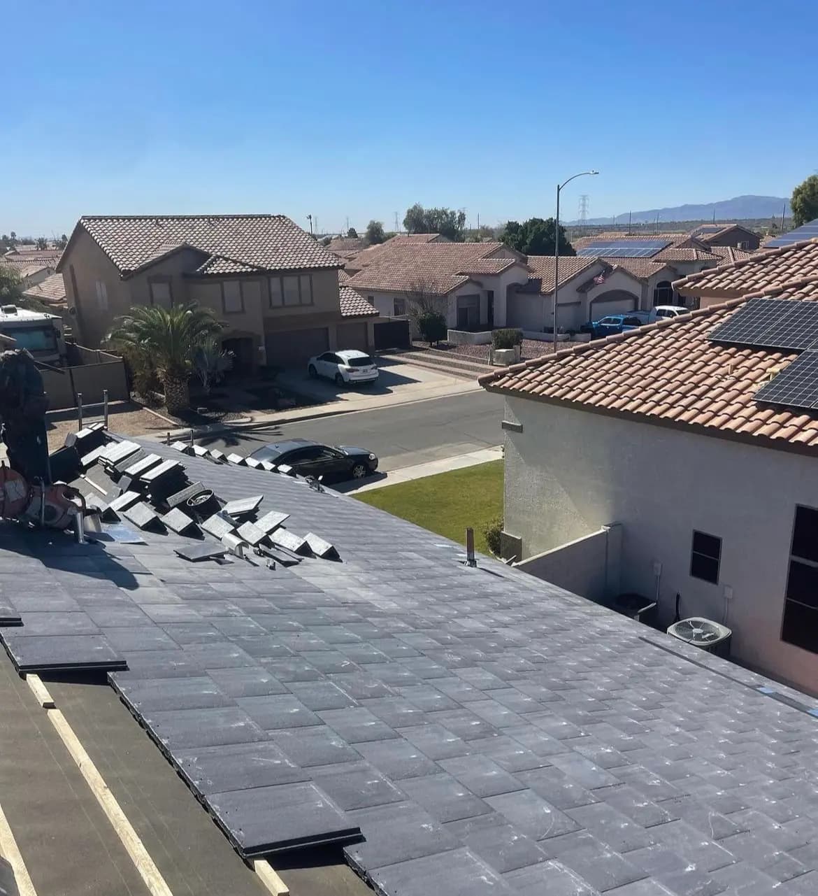 New roof deck being laid on a home overlooking an Arizona subdivision